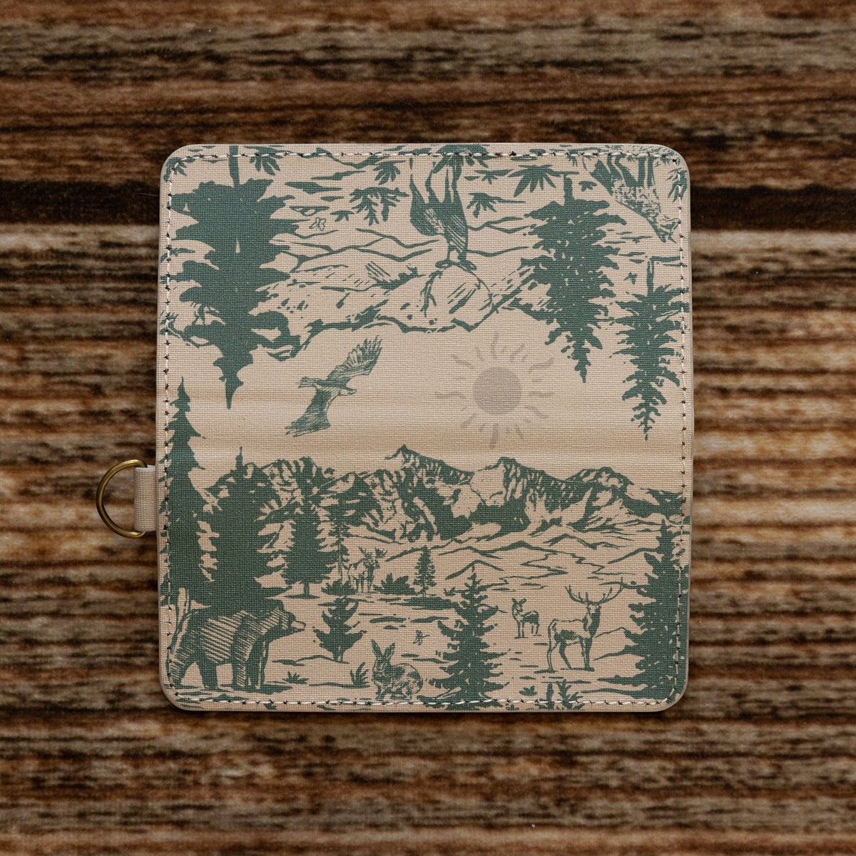 Wildtree Woodland Landscape card holder by Forager Provisions LTD featuring a green forest and mountain print on fabric.