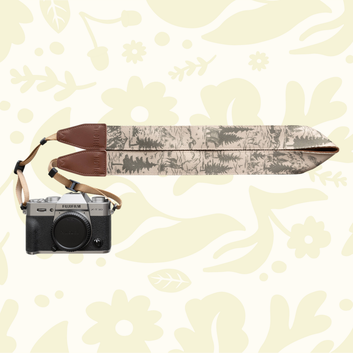 Forager Provisions LTD Wildtree camera strap with woodland mountain landscape print attached to a Fujifilm camera