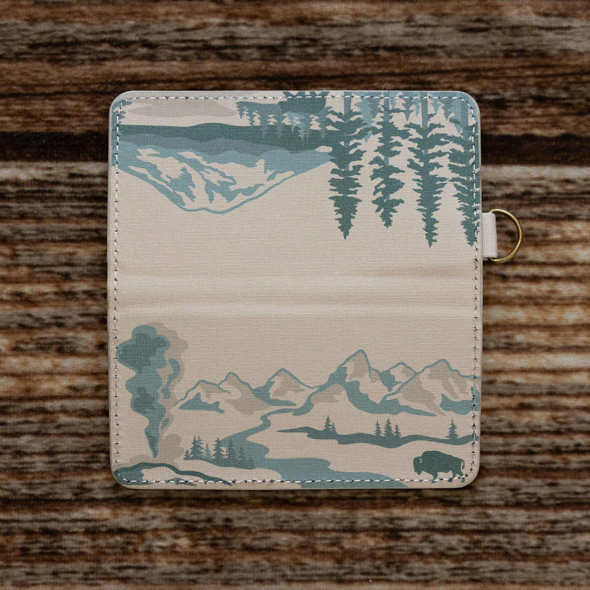 Forager Provisions LTD Wildtree National Parks card holder with outdoor landscape print on a rustic wooden background.