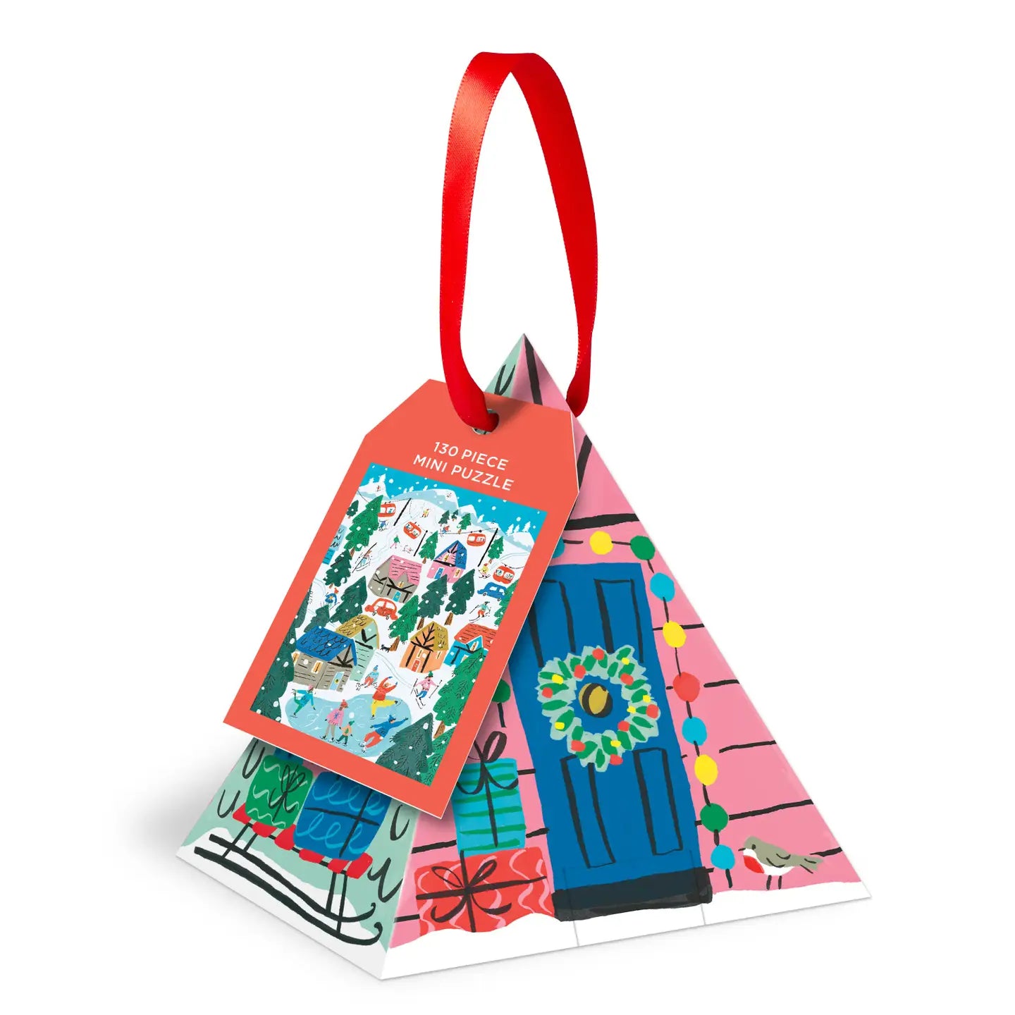 Brass Monkey pyramid box with festive holiday design and tag, featuring the Alpine Cottage Christmas Puzzle Ornament gift.