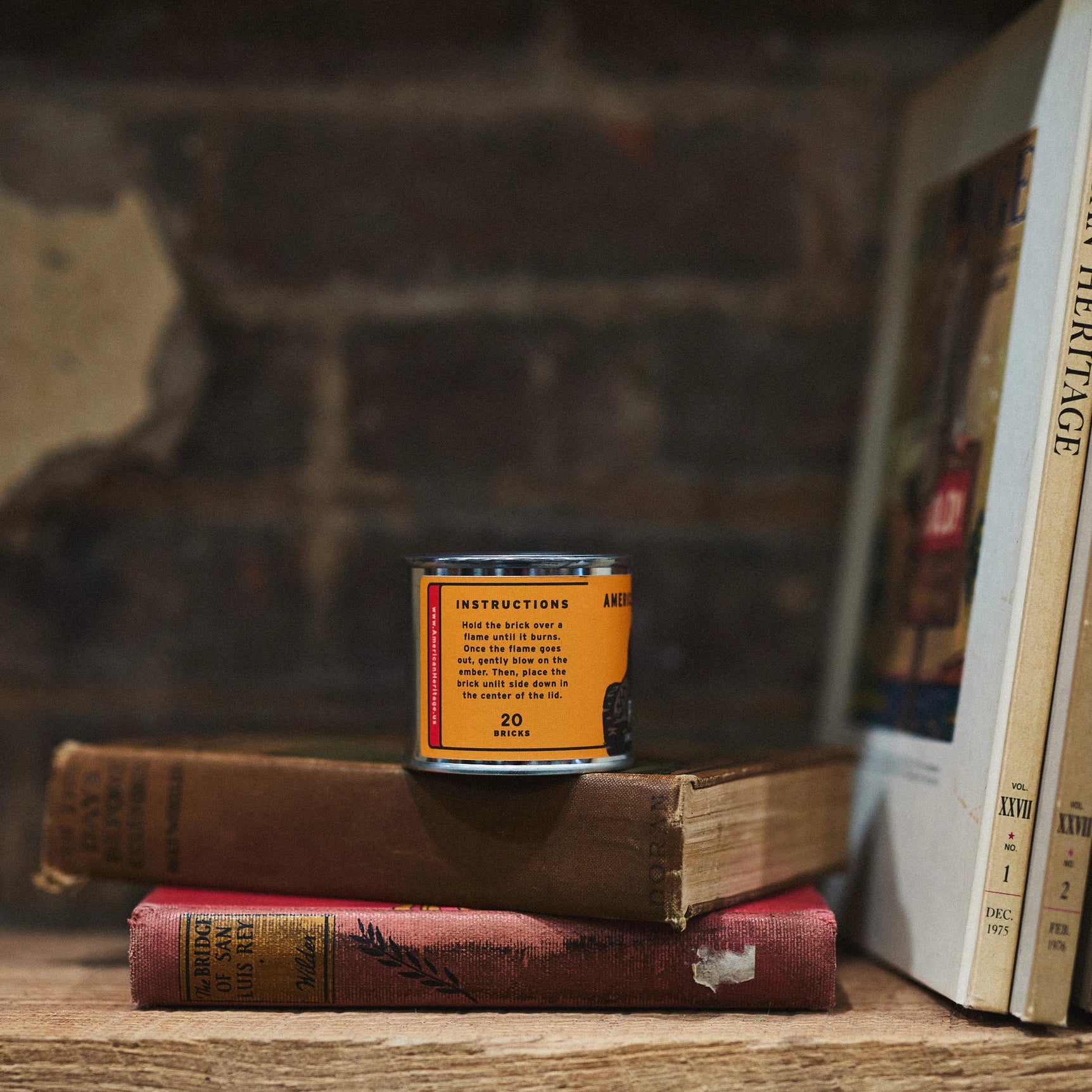 Piñon 20 Incense Bricks by American Heritage Brands can sits on vintage books, brick wall backdrop; natural home fragrance.