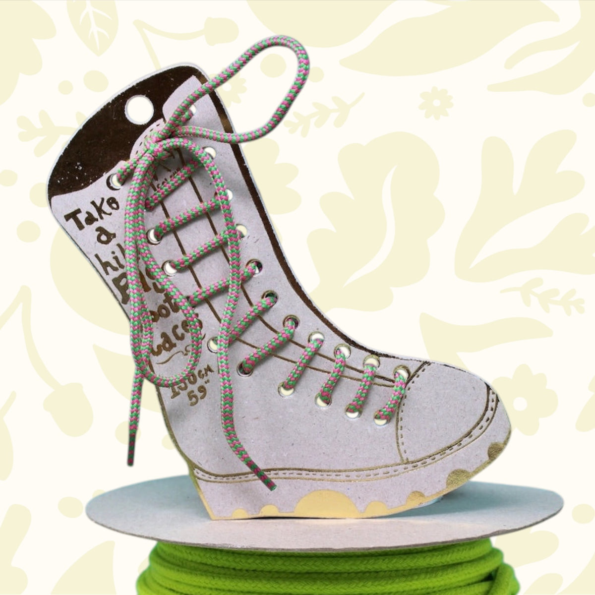 Bright green/pink The Ark Big Boot Laces shown on neon green cord with blue and green Ark branding backdrop—colorful footwear accessory.