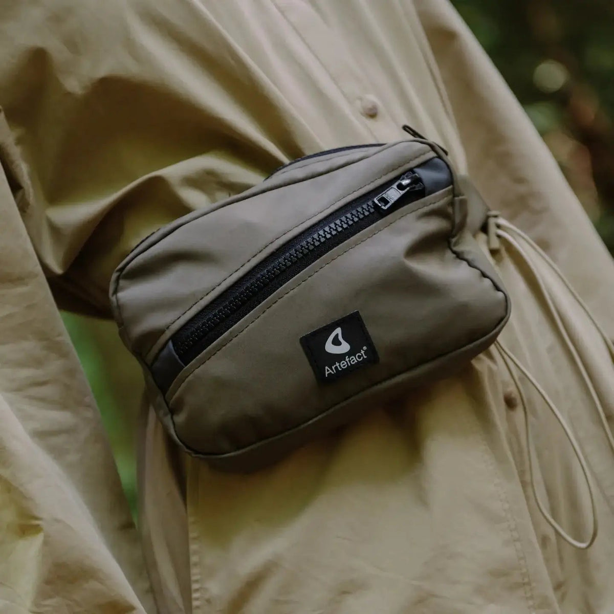 Forager Provisions LTD Artefact Eco Hornbill sling bag in olive green, crafted from upcycled waterproof wader fabric.