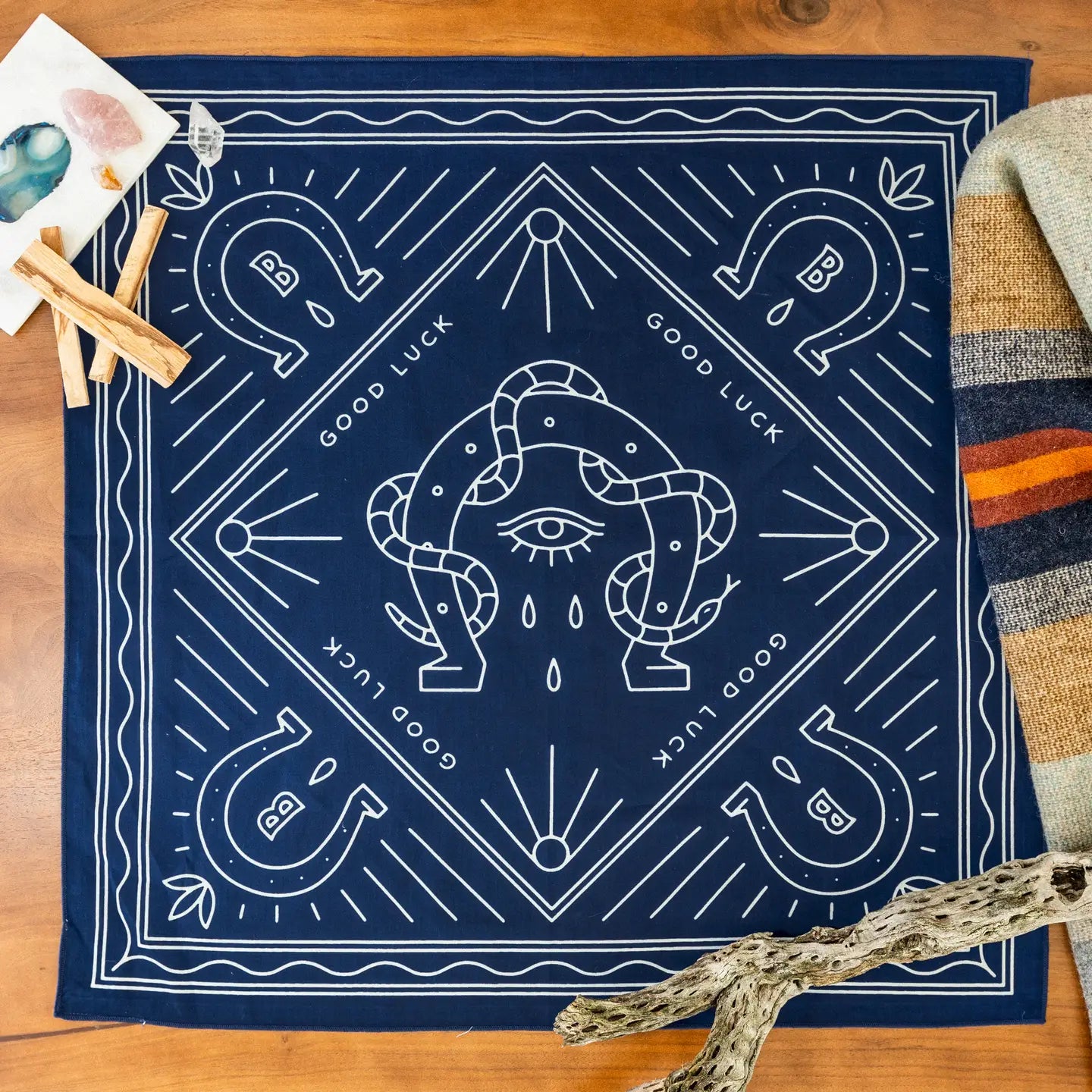 Bandit Bandanas “Good Luck” bandana: navy organic cotton, white line art horseshoes, eye, hands, GOOD LUCK text.
