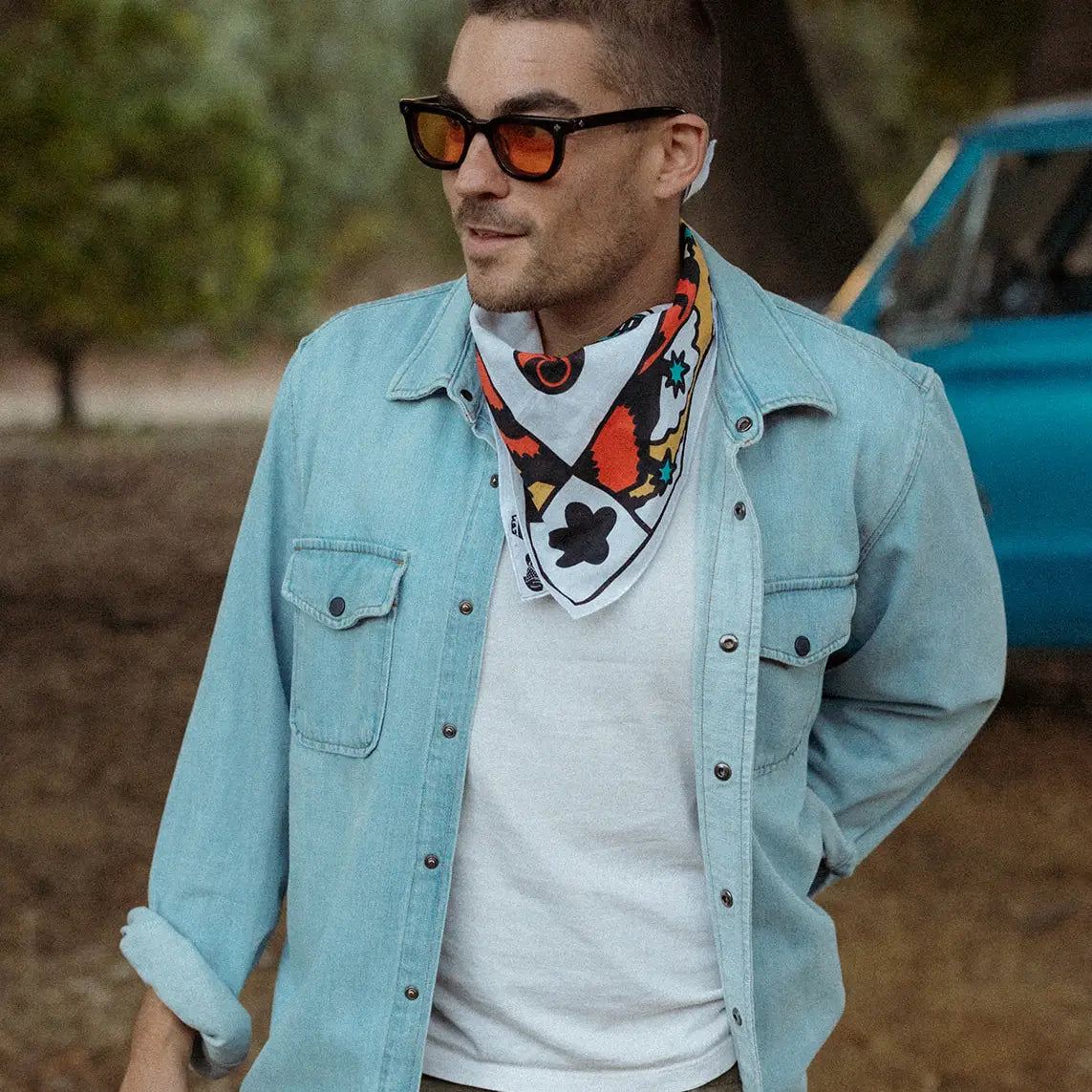 Forager Provisions LTD Bandits Bandanas cotton bandana with Keep A Breast print worn by a man in a denim shirt