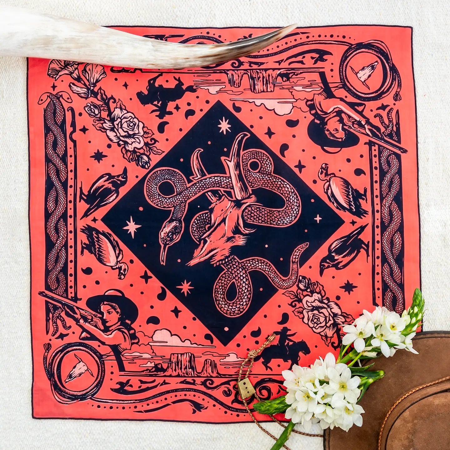 Bandits Bandanas “Rattle & Hiss”—pink/navy Western bandana with floral print, cowboy hat, and horn accents.