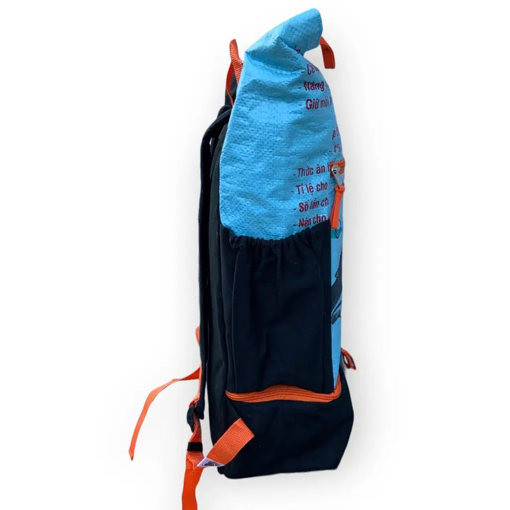 The BEadbags Ri102 upcycled rucksack: light blue & black eco-friendly backpack with orange straps, side pocket, sustainable style.
