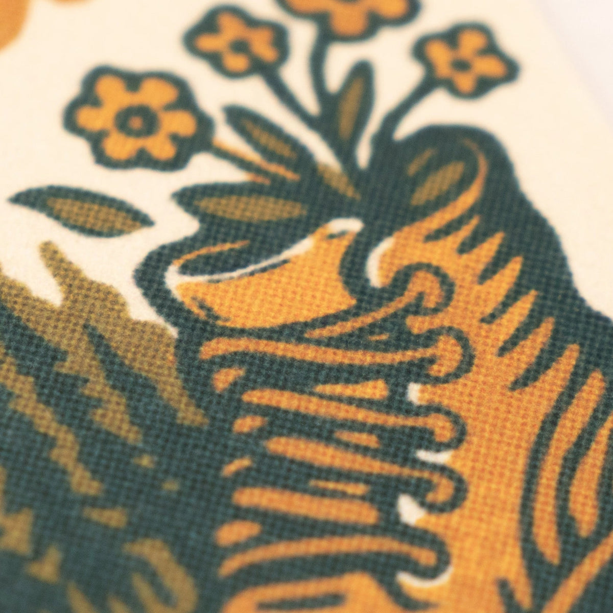 Close-up of Forager Provisions LTD felt pennant featuring a vintage-style graphic of a hiking boot with wildflowers.