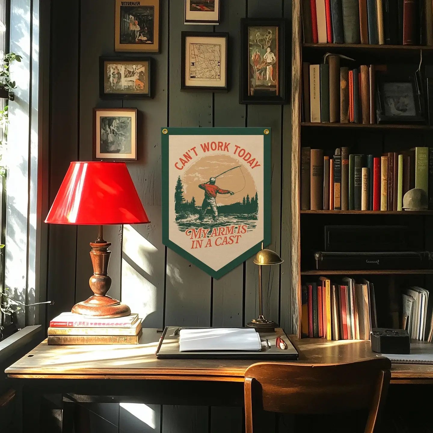 Vintage desk with typewriter, lamp, books, art, window view, and Benoit’s “Can’t Work Today” felt banner for creative workspace.