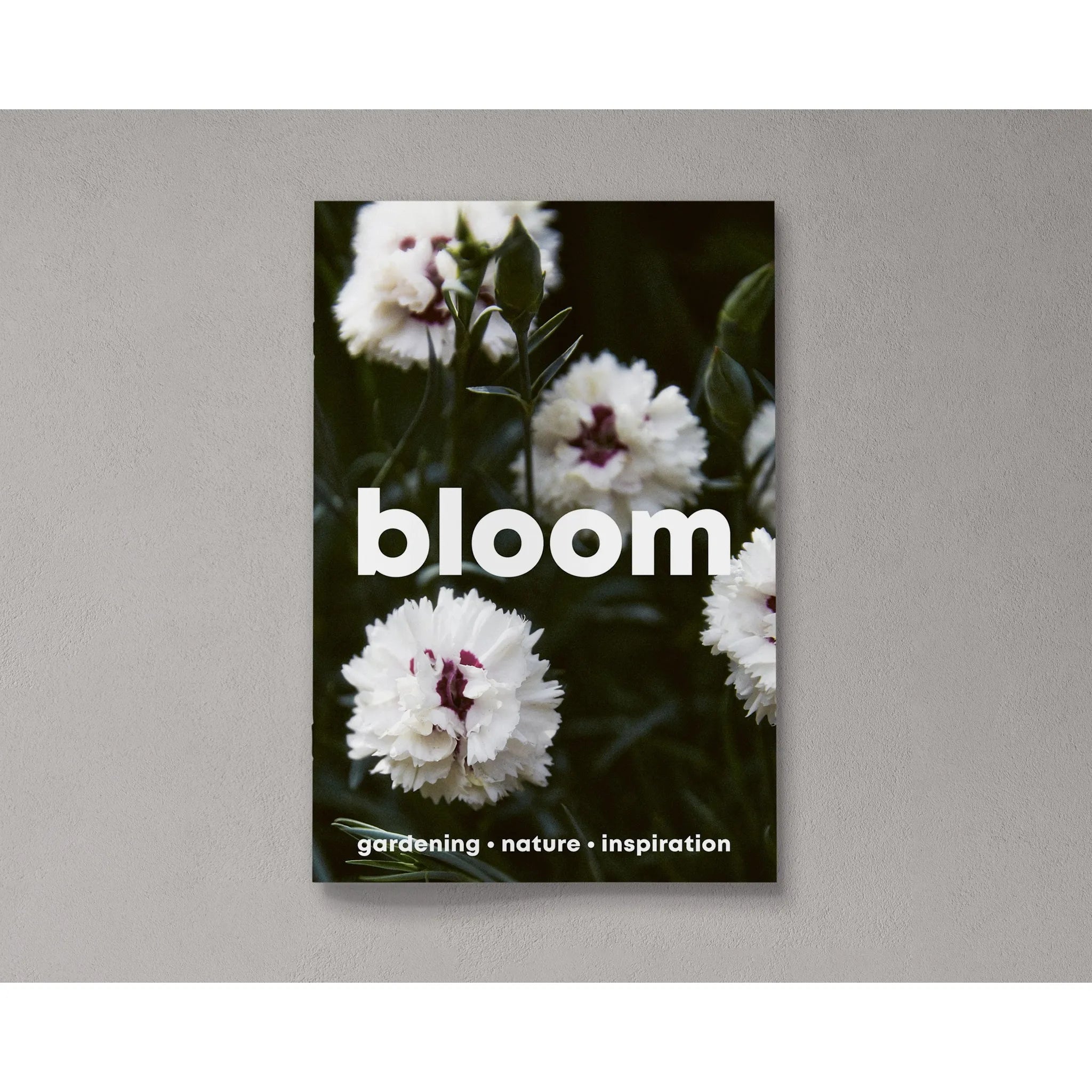 Book featuring white flowers and the word "bloom" in bold. Text at the bottom reads "gardening • nature • inspiration." Perfect for your Bloom Zine Issue 14 Spring/Summer 2023 collection.