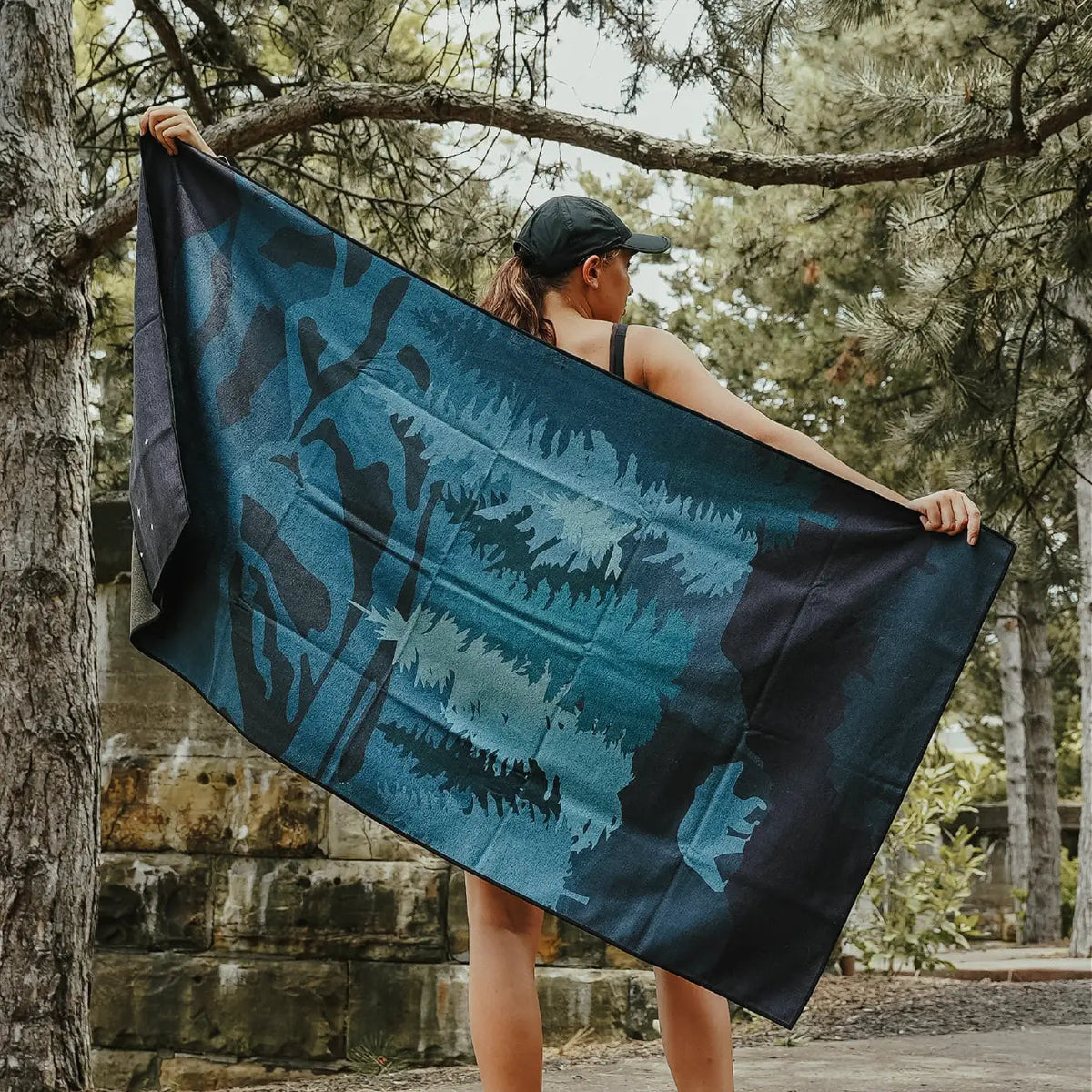 Forager Provisions LTD Sprints Nightfall Grizzly car seat towel featuring a dark forest and bear silhouette print.