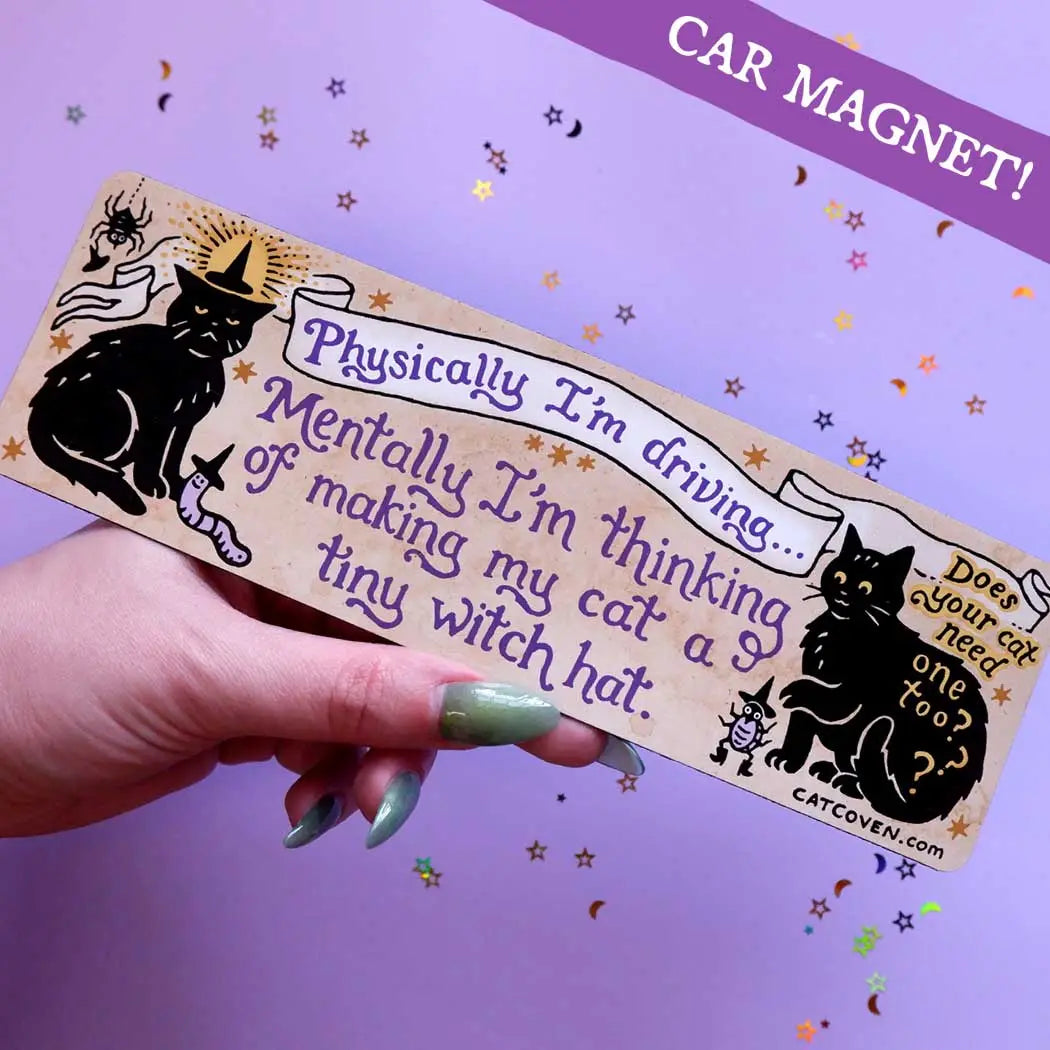 Hand displays the Cat Coven Tiny Witch Hat Car Magnet, a perfect gothic car accessory for spooky, witchy Halloween style.