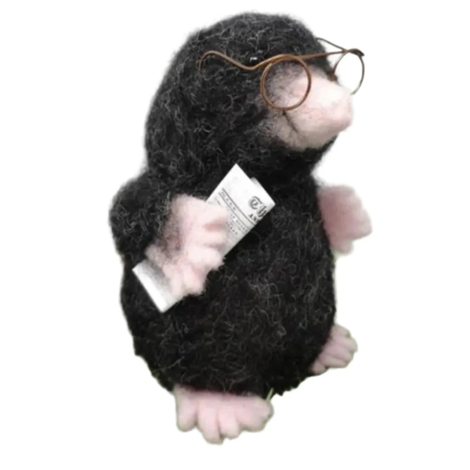 Image showcases an upclose image of a mole, wearing glasses and holding a newspaper.