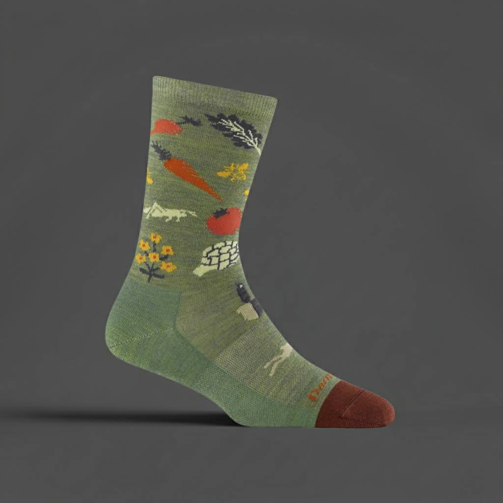 Forager Provisions LTD Darn Tough lightweight merino wool crew socks in willow green with a vegetable garden pattern.