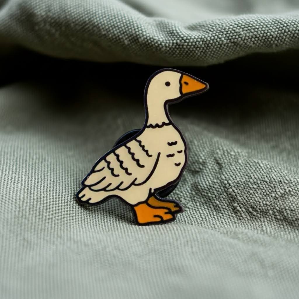 Forager Provisions LTD Stay Home Club Fowl enamel pin featuring a cute goose illustration on sage green fabric.