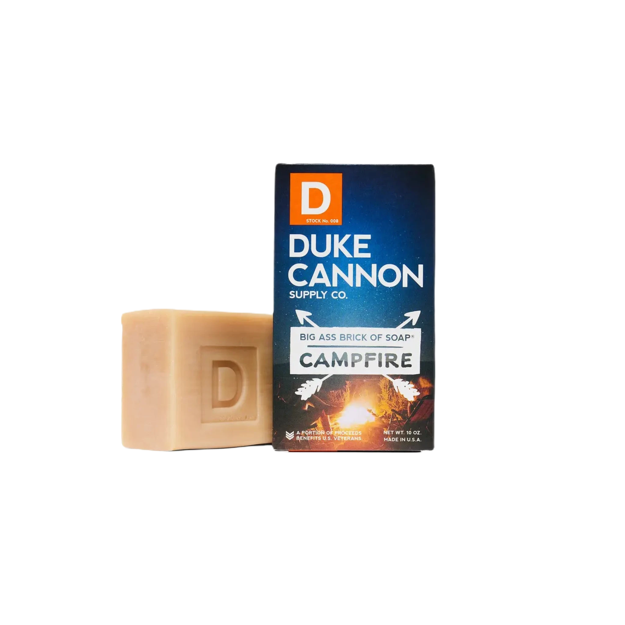 A large bar soap next to boxed packaging labeled "Duke Cannon Big Ass Brick Of Soap - Campfire," emitting a distinct smoky scent, proudly American-made.