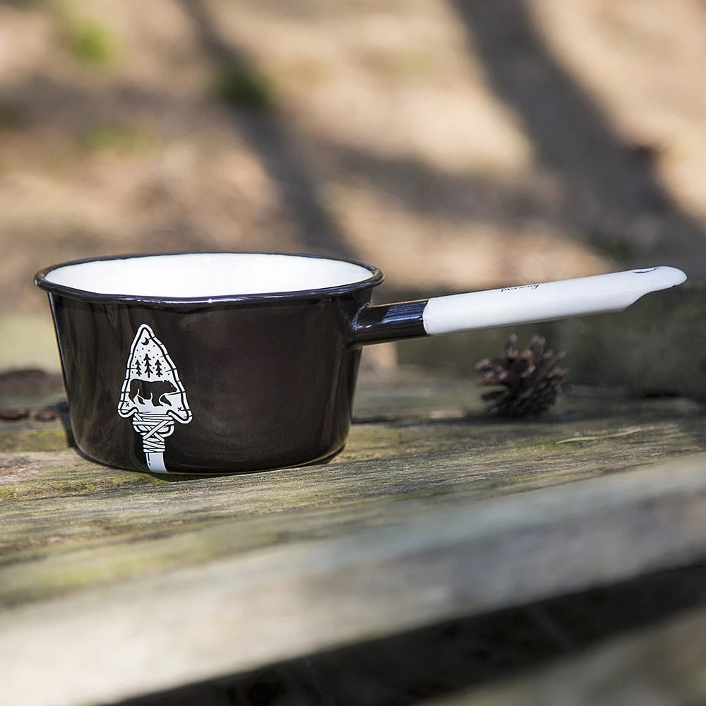 Showcases The Bear & Arrow Motif Saucepan In The Outdoor Table Environment