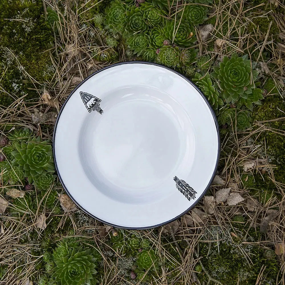 An Emalco Enamelware 9.5 Arrow Plate in white ceramic features intricate black illustrations of a squid and a fish, bordered by a black rim, set against a plain background. The plate demonstrates exceptional enamel durability, ensuring lasting quality and charm.