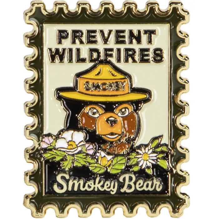 Smokey Bear enamel pin by The Landmark Project, featuring Smokey in ranger hat with PREVENT WILDFIRES forest safety message.
