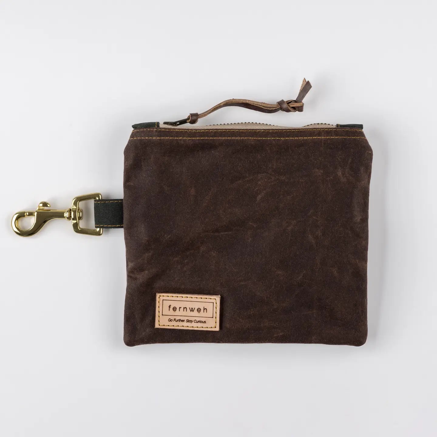 The Fernweh UK Lochan Bracken Brown pouch, handmade in Scotland, features waxed cotton, brass clip, and leather label.