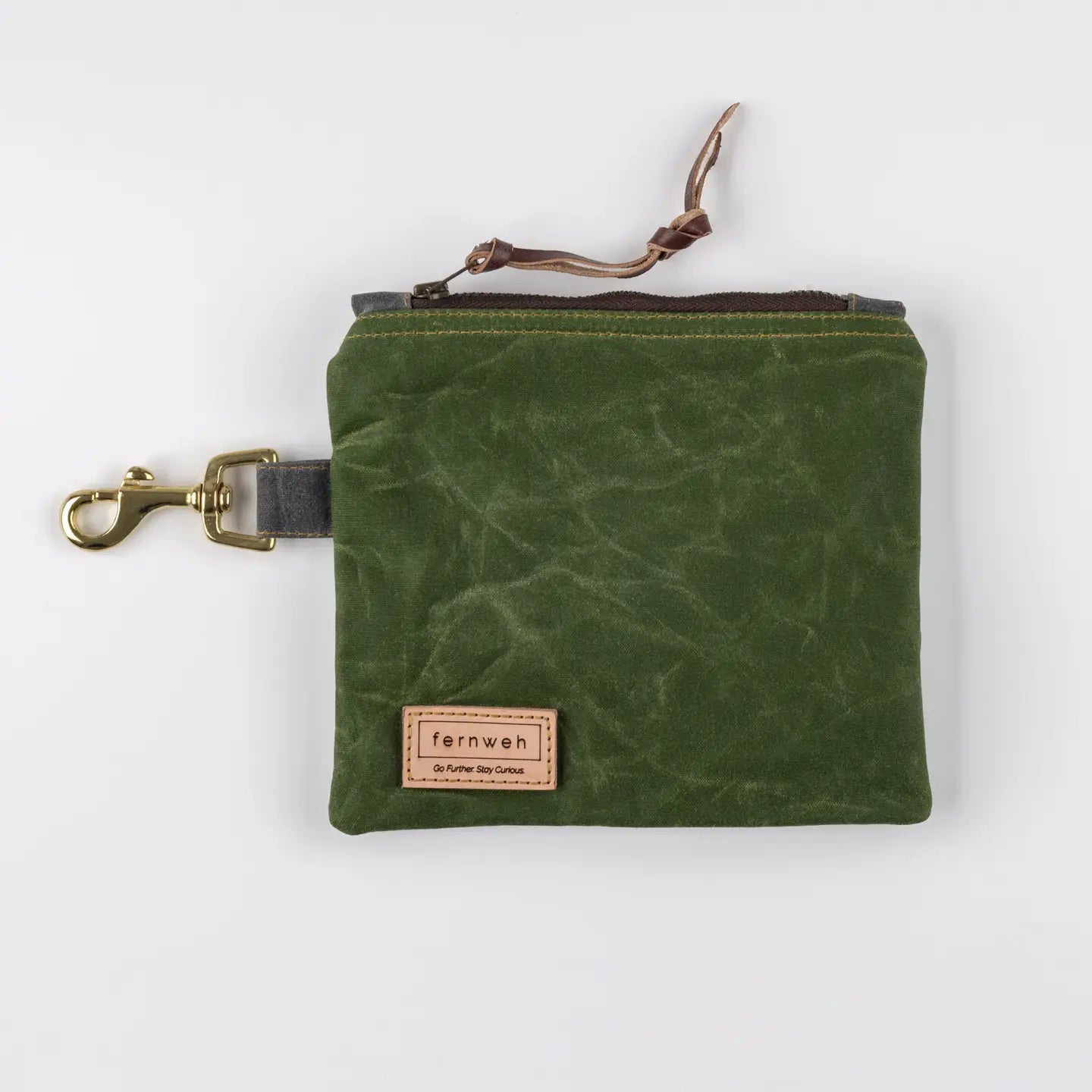 Fernweh Lochan Moss waxed cotton wallet, leather zip pull, tan Fernweh label, made in Scotland; stylish and durable accessory.
