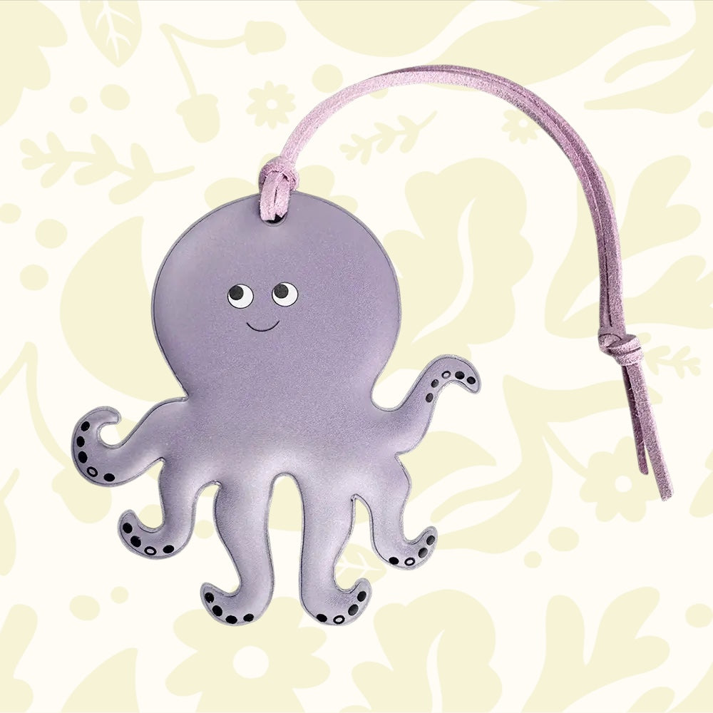 Firefly Sweden Octopus Reflector Bag Charm: purple flat safety tag with strap, perfect cute accessory for visibility and style.