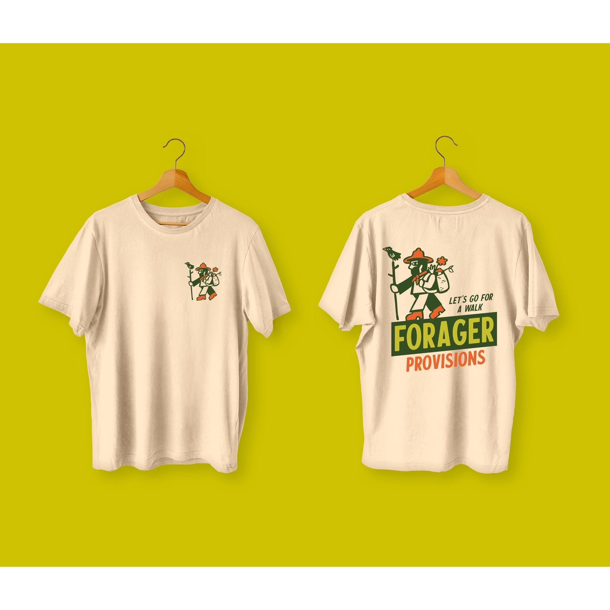 Two relaxed fit Natural Raw Ecru T-Shirts on hangers, featuring a forager graphic. One shirt has "Forager Provisions" text larger on the back. Made from soft organic cotton, these Forager Provisions ‘Lets Go For A Walk’ T-Shirts offer both comfort and style.