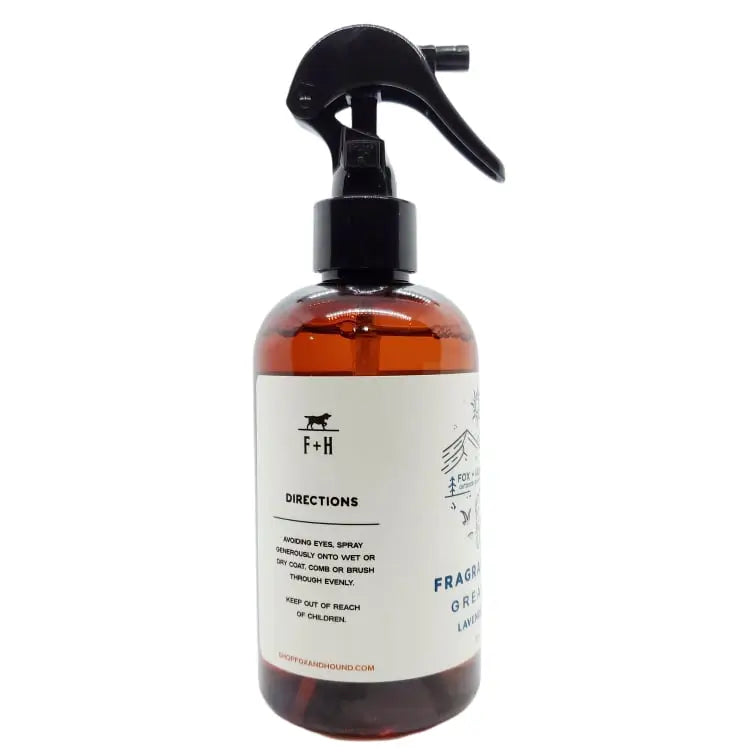 A brown bottle of Fox + Hound Dog Cologne - Yellowstone with a black sprayer and an illustration on the label, part of the Outdoor Adventures Collection.