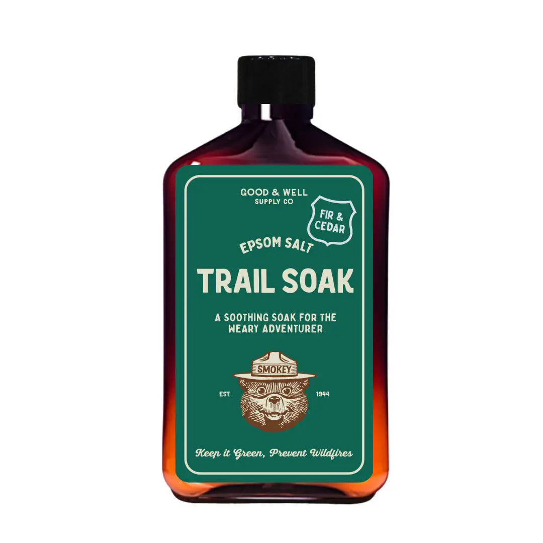 Good & Well Supply Co Smokey Bear Trail Soak—fir, cedar bath soak with Smokey Bear label; natural, aromatic relaxation.