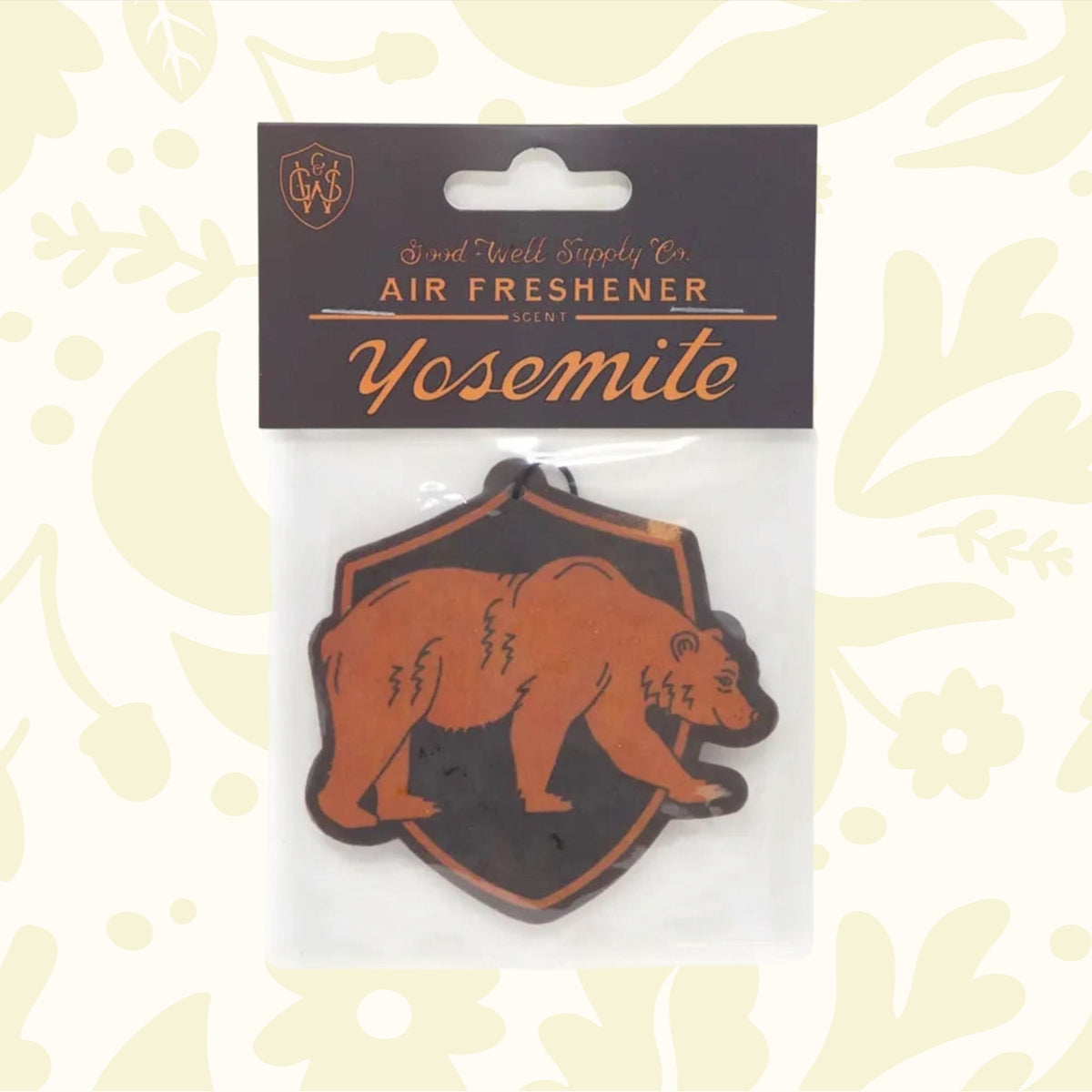 Good & Well Supply Co Hangable Air Freshener - Yosemite, featuring an illustration of a brown bear within a black shield outline on the packaging, proudly supported by the National Park Foundation.