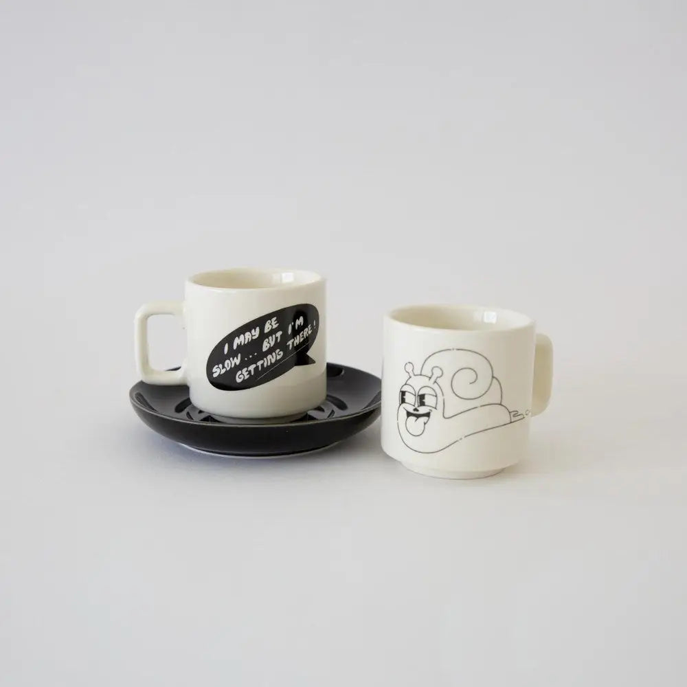 Third Drawer Down x Hattie Stewart Slow Snail Espresso Cup Set: two playful collectible white espresso cups, fun gift idea.