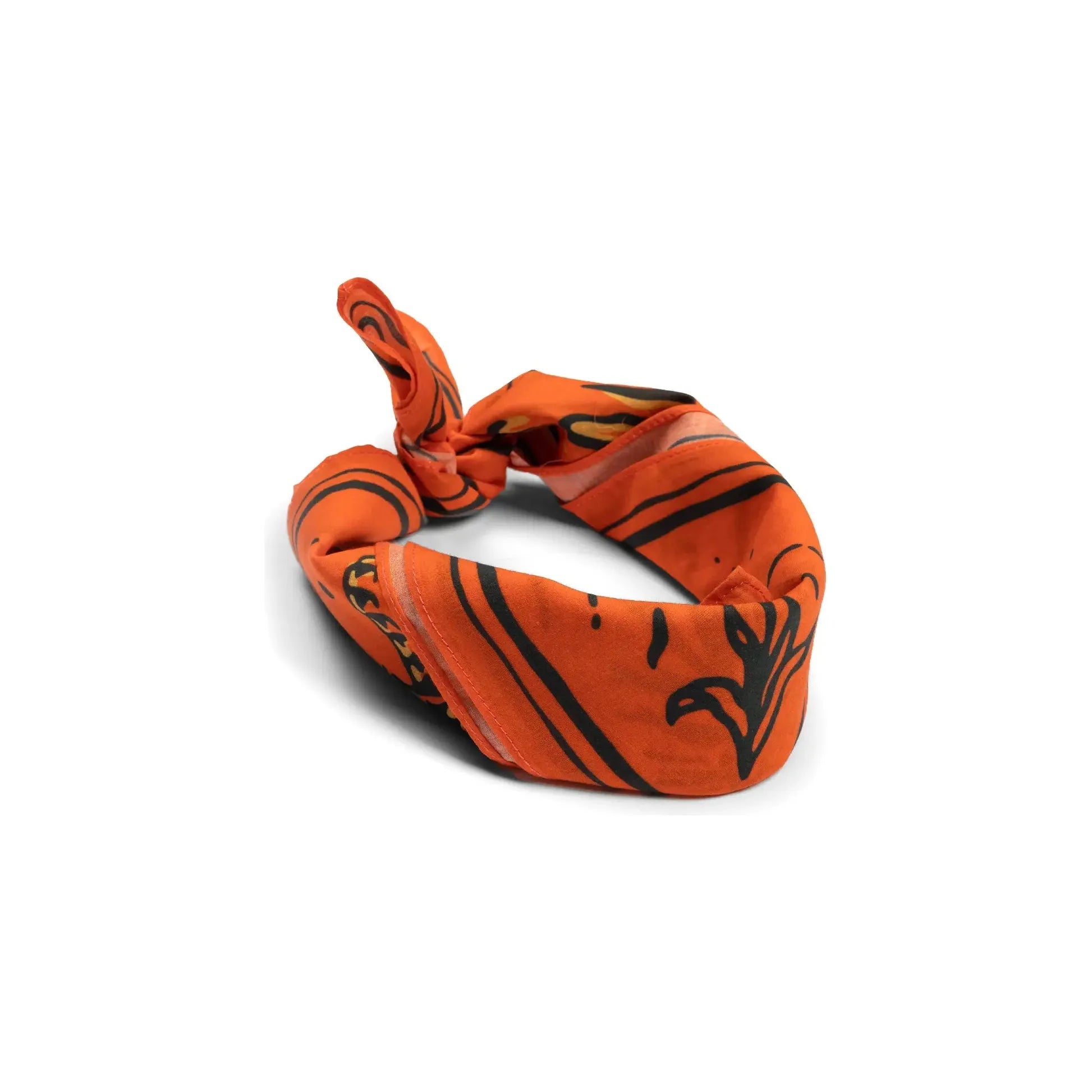 A twisted Le Roy Brown Bandana from Sendero Provisions, featuring black patterns on orange organic Japanese cotton and styled in a knot, displayed on a white background.