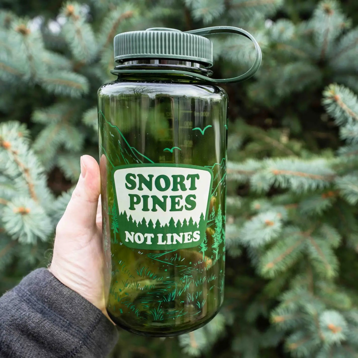 Forager Provisions LTD green Nalgene 32oz wide-mouth water bottle with Snort Pines Not Lines graphic in a pine forest.
