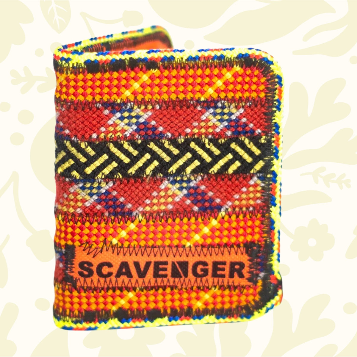 Colorful Scavenger wallet made from upcycled climbing rope with geometric designs and bold branding—eco-friendly accessory.
