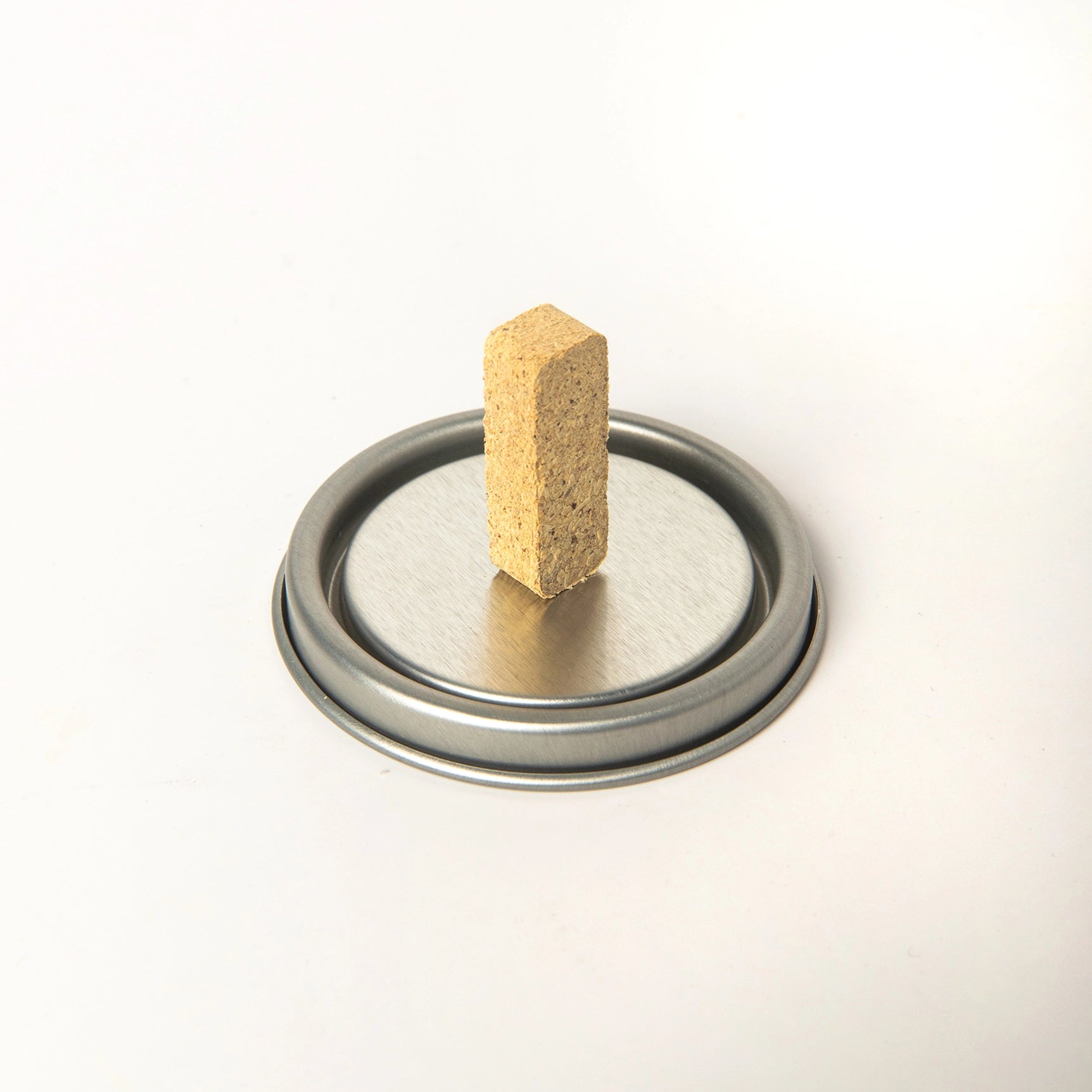 American Heritage Brands Juniper 20 Incense Bricks box upright on metal lid, perfect for aromatherapy, against white background.