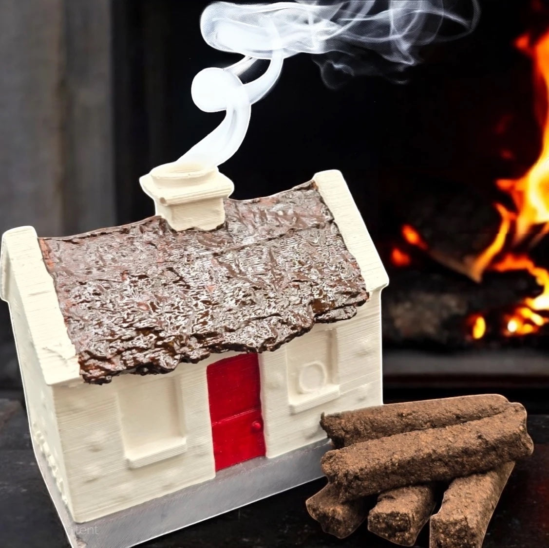 Forager Provisions LTD Aureal Aromatics peat incense sticks beside a miniature cottage burner with smoke rising