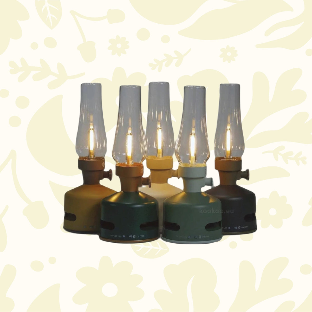 Five KOOKOO MoriMori Camp LED Lanterns & Loud Speakers in various colors (yellow, brown, white, green, and raspberry red) arranged in a semi-circle against a plain background create an ambiance reminiscent of a portable lamp collection.