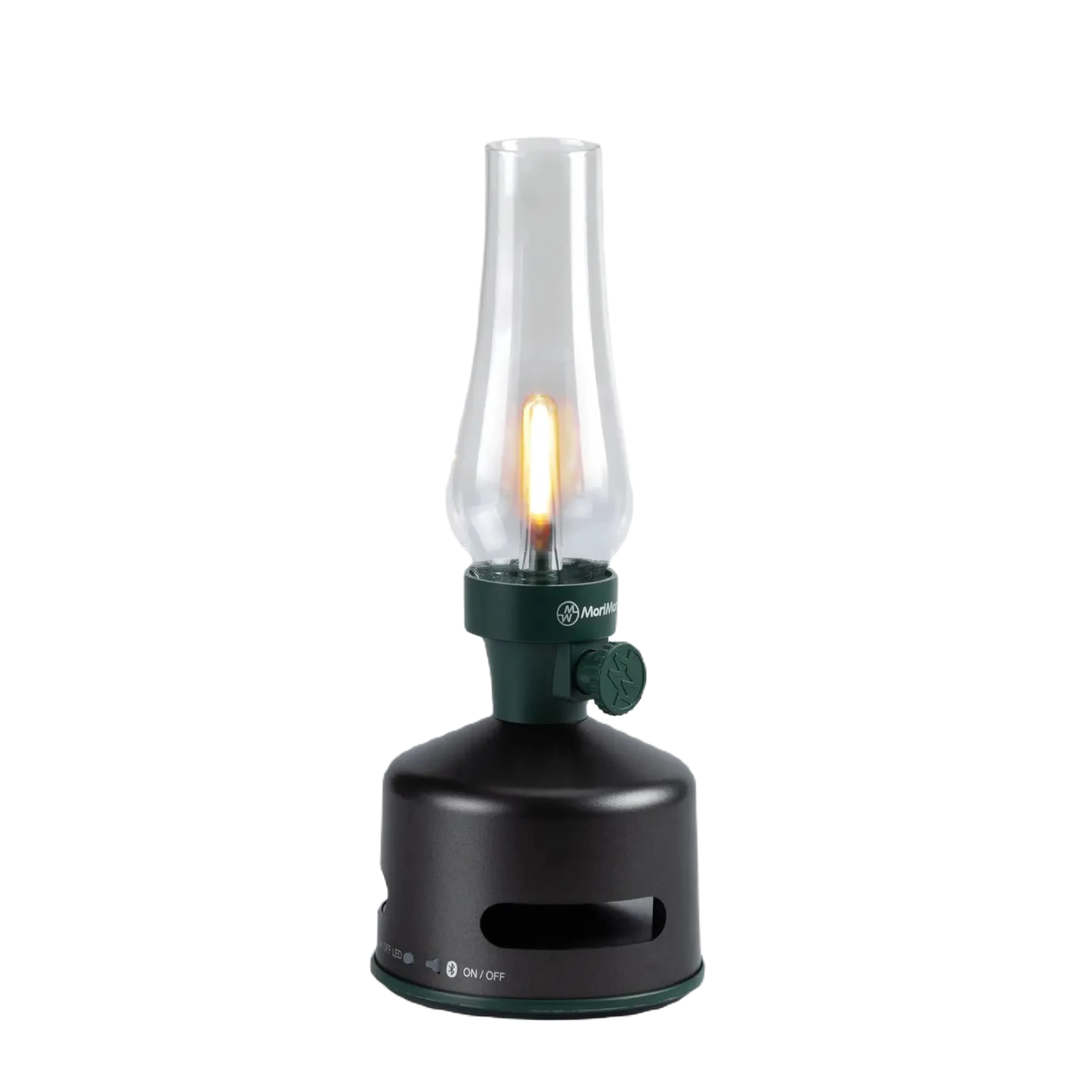Introducing the KOOKOO MoriMori Camp LED Lantern & Loud Speaker in Green & Black, a modern lantern featuring a tall, clear glass enclosure and a sleek black base. It includes an adjustable control knob on the side for easy light adjustment. Combining retro aesthetics with contemporary functionality, this versatile lamp also serves as a powerful loudspeaker.