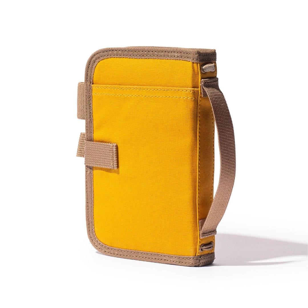 Forager Provisions LTD Lochby Mini Field Journal in mustard waxed canvas with a side carry handle and elastic closure.