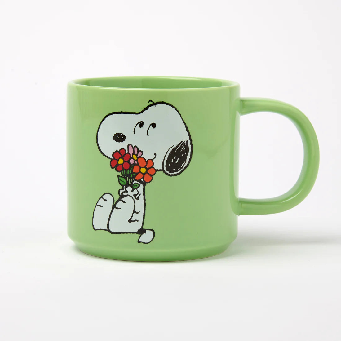Magpie Gifts Snoopy Green Mug Posey: Light green mug with Snoopy holding flowers, perfect gift for Peanuts and Snoopy fans.