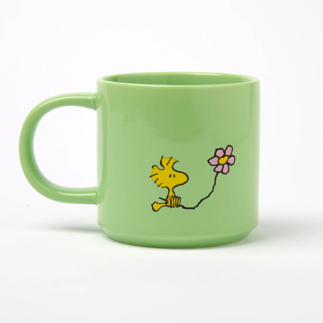 Magpie Gifts Snoopy Green Mug features Snoopy and Woodstock with a pink flower on light green mug—cute Peanuts collectible gift.