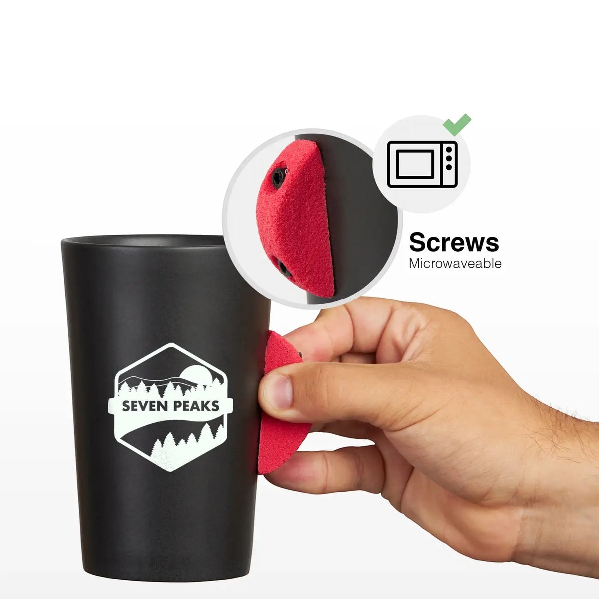 A hand attaches a red grip to a Seven Peaks Climber 7a mug; microwave-safe, ideal gift for rock climbers and hikers.