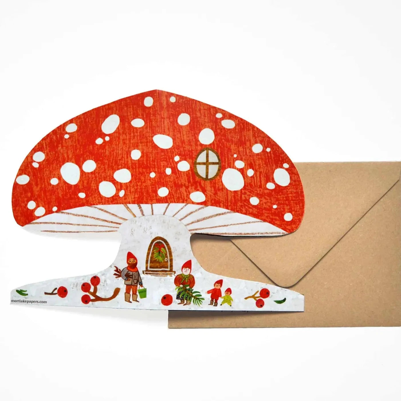 A mushroom shaped card laid out on a brown envelope