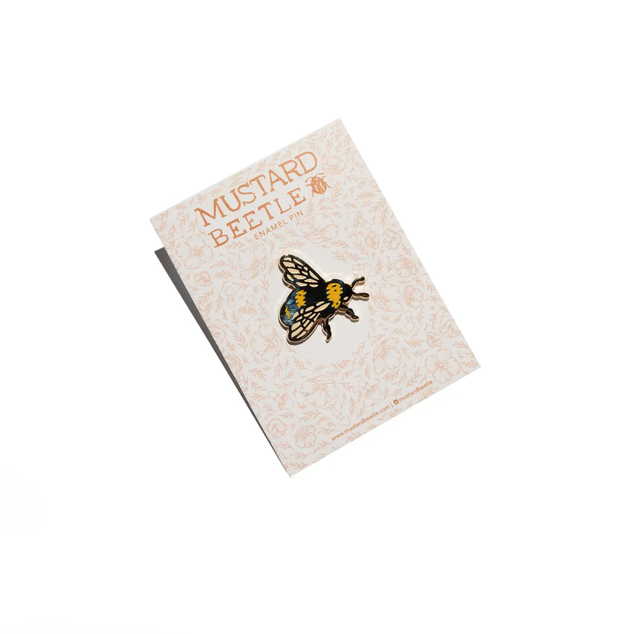 Limited Edition Mustard Beetle Bee Mirrored Pin showcasing an original illustration of a mustard beetle on a decorative backing card adorned with intricate patterns and the text "Mustard Beetle.