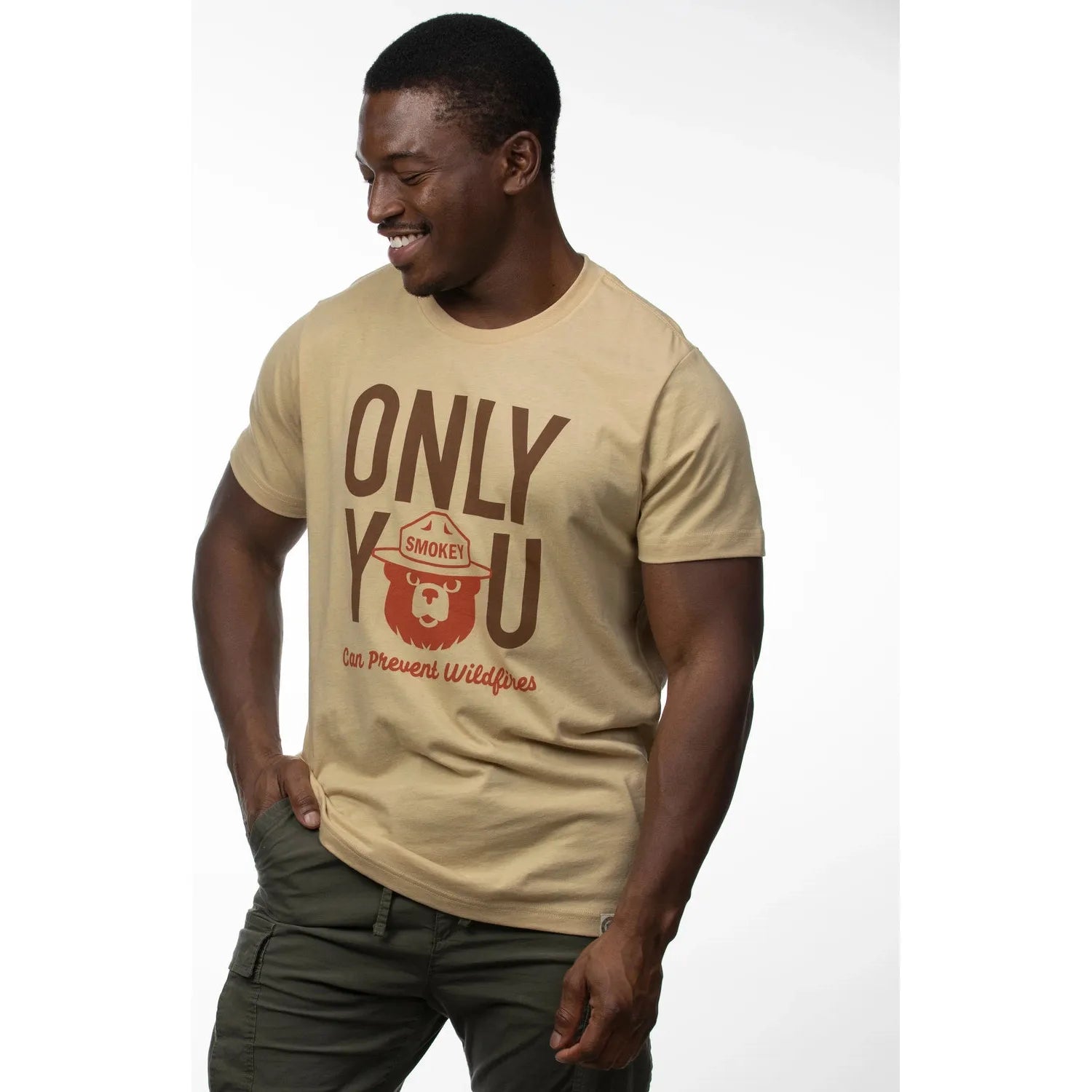 Sustainably made "The Landmark Project Only You Smokey Bear T-Shirt - Fossil," featuring the text "Only You Can Prevent Wildfires" and an image of Smokey Bear wearing a ranger hat.