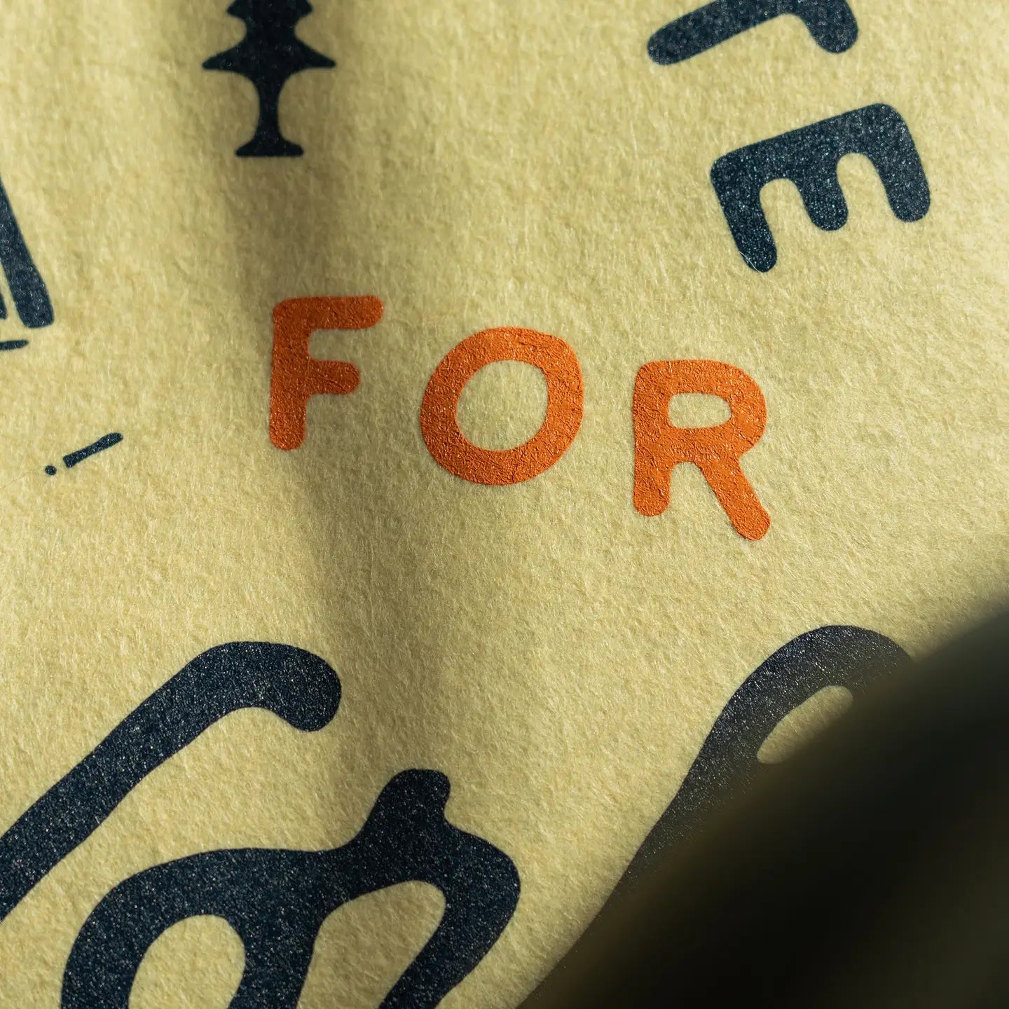 Oxford Pennant “There Is No Substitute For Hard Work” camp flag on yellow textured paper, motivational quote close-up.