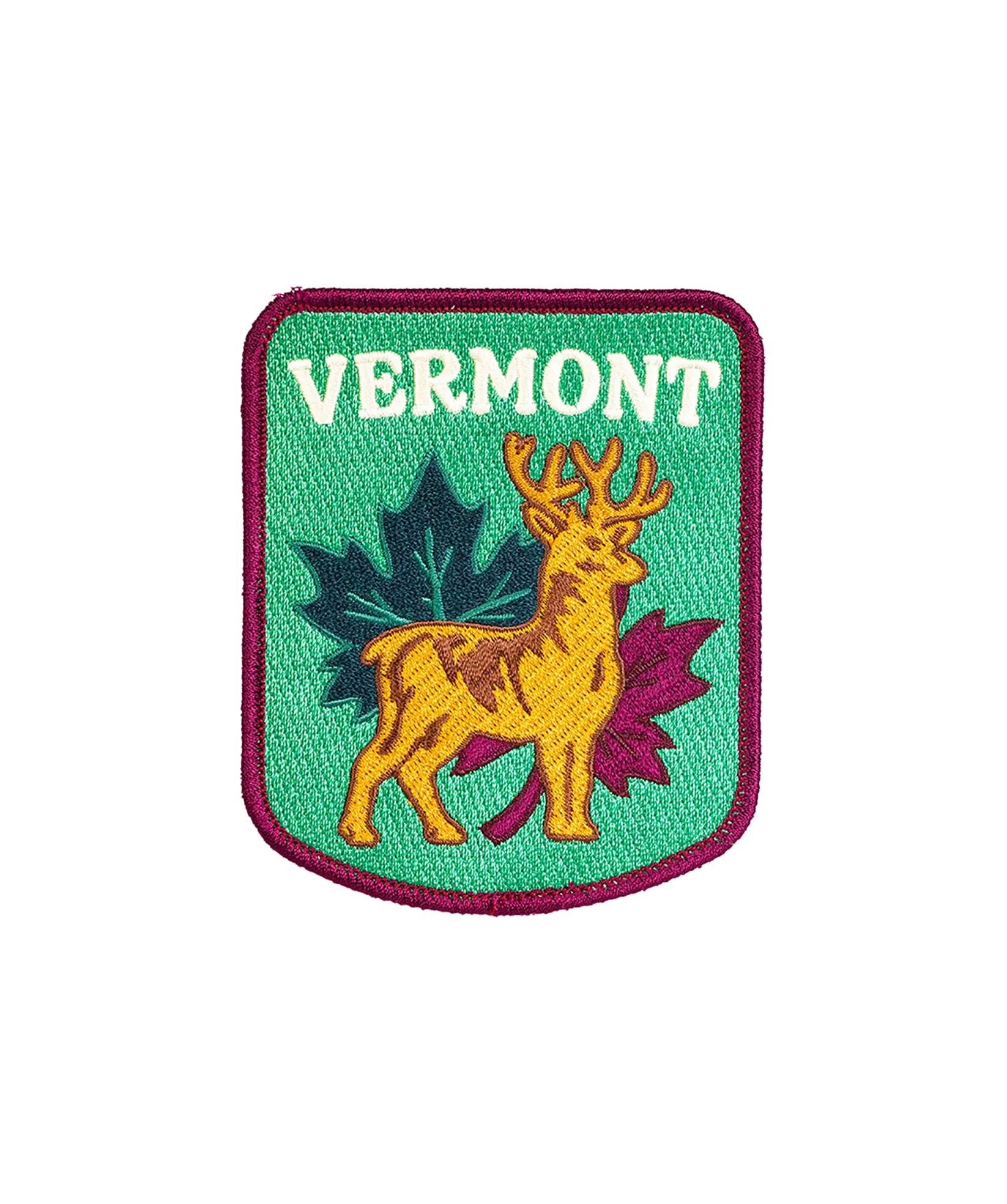 Oxford Pennant Vermont Stag Patch—green patch with deer and leaves, purple border. Vermont state pride collectible accessory.