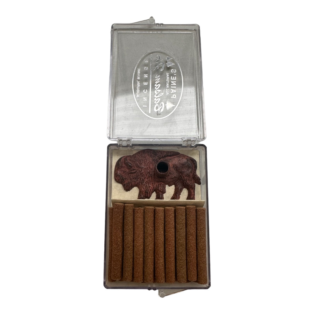 A partially open silver case containing a PAINES Bronze Finish Buffalo Holder and 18 brown balsam fir logs aligned in slots.