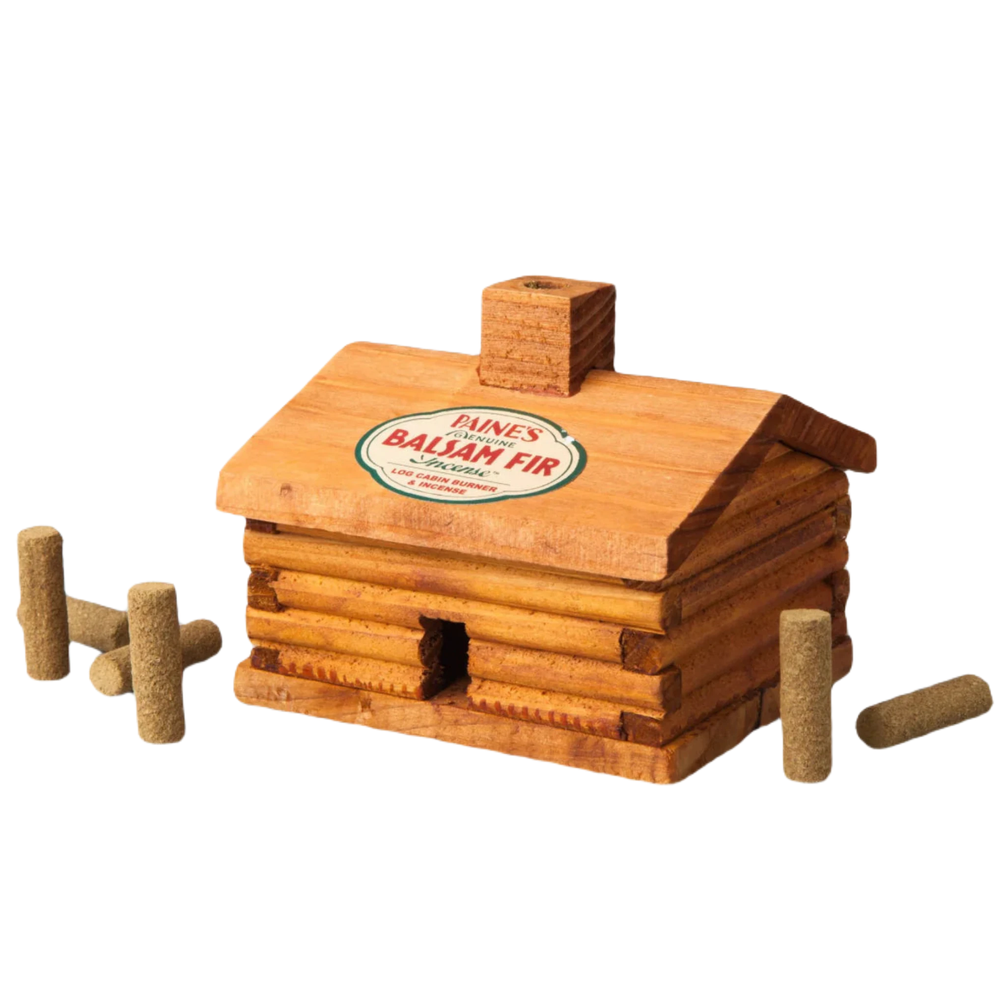 The PAINES Balsam Fir 10 Incense Log Cabin, adorned with the "Pine's Balsam Fir" label, is surrounded by small cylindrical incense sticks on a gray background. This charming wooden log cabin burner releases the soothing fragrance of balsam incense, perfect for creating cozy evening vibes.