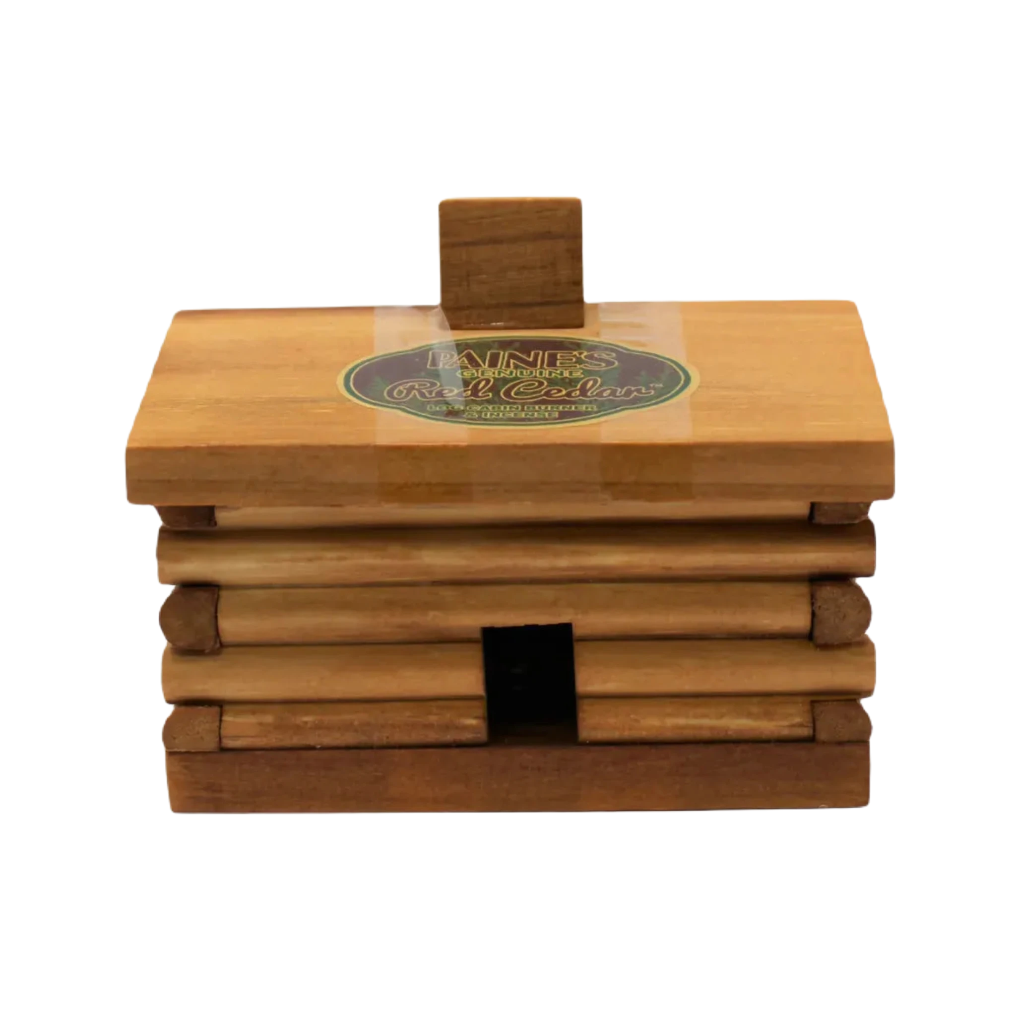 The PAINES Red Cedar 10 Incense Large Log Cabin is a small wooden log cabin featuring a sticker on the roof that reads "Barnes Genuine Red Cedar." This cabin, known as the Large Cabin Burner, has a slot at the bottom perfect for burning Red Cedar Incense.